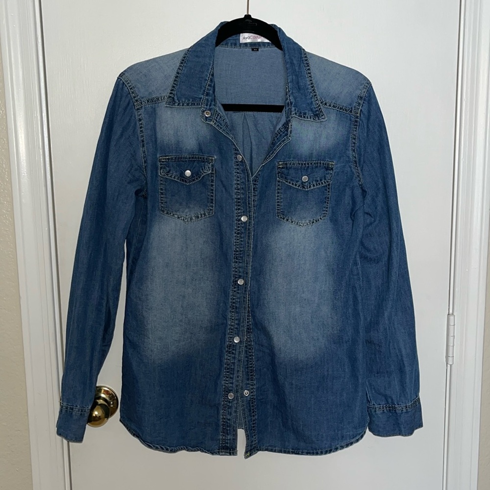 Denim long sleeved shirt w accented worn area and pearlescent snap front closure